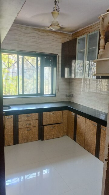 Kitchen in 1 BHK Apartment at Raj Shivam Society, Dahisar East – for Sale