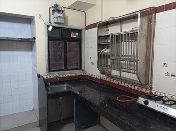 Kitchen in 2 BHK Apartment at Rutu Estate, Brahmand – for Sale