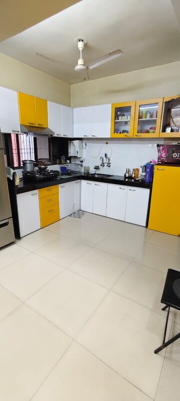 Kitchen in 2 BHK Apartment at Brahmand CHS, Brahmand – for Sale