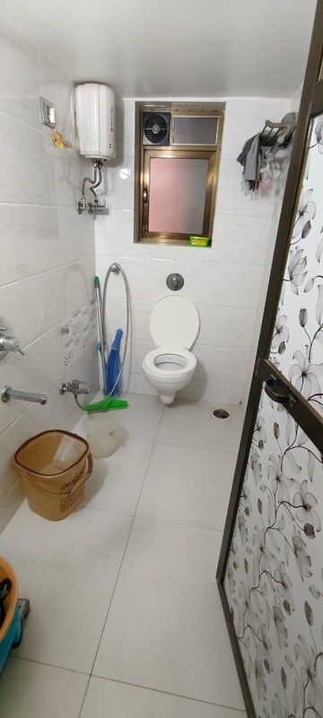 Bathroom in 2 BHK Apartment at Brahmand CHS, Brahmand – for Sale