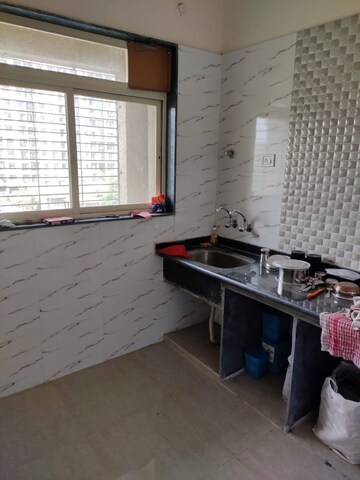Kitchen in 1 BHK Apartment at Mohan Willows, Badlapur East – for Sale