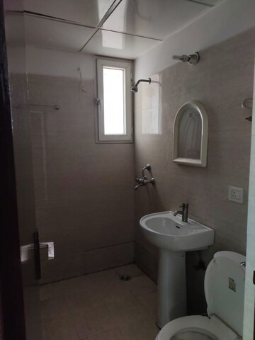 Bathroom in 2 BHK Apartment at Aims Golf City, Sector 75 – for Sale