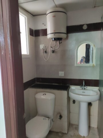 Bathroom in 2 BHK Apartment at Aims Golf City, Sector 75 – for Sale