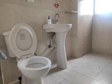 Bathroom in 2 BHK Apartment at Aims Golf City, Sector 75 – for Sale