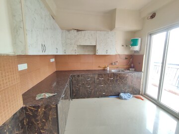 Kitchen in 2 BHK Apartment at Aims Golf City, Sector 75 – for Sale