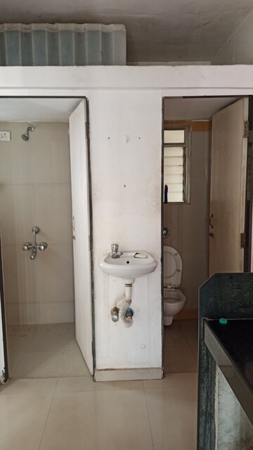 Bathroom in 1 BHK Apartment at Unicorn Global Arena, Naigaon East – for Sale