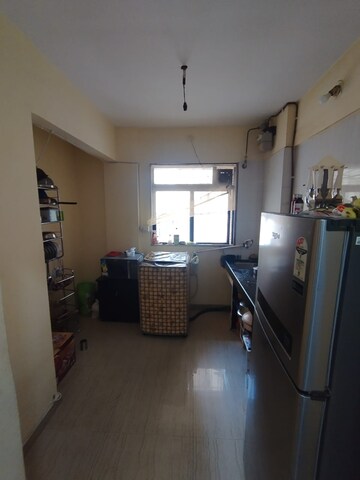 Kitchen in 1 BHK Apartment at Raunak Unnathi Woods Phase 4 And 5, Ghodbunder Road – for Sale
