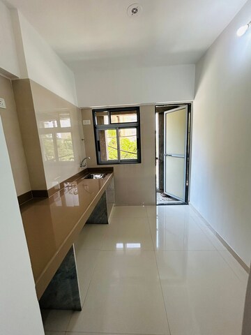 Kitchen in 1 BHK Apartment at Cosmos Meluha, Shilphata – for Sale