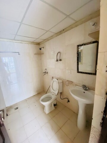 Bathroom in 3 BHK Apartment at Aims Golf Avenue II, Sector 75 – for Sale