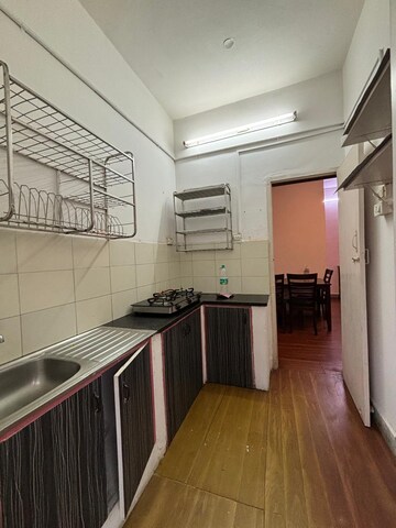 Kitchen in 2 BHK Apartment at Ganpat Apartment, Indiranagar – for Rent