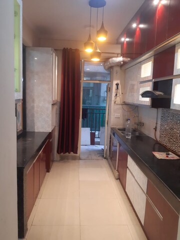 Kitchen in 3 BHK Apartment at Paramount Symphony, Sain Vihar – for Sale