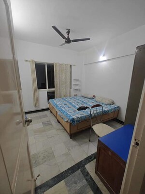 Master Bedroom in 2 BHK Apartment at Palace Orchard CHS, Mohammadwadi – for Rent