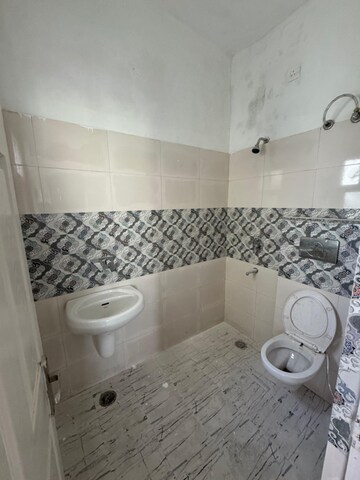 Bathroom in 3 BHK Apartment at Dhakoli Village – for Sale