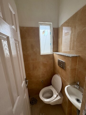 Bathroom in 3 BHK Apartment at Dhakoli Village – for Sale