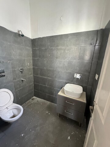 Bathroom in 3 BHK Apartment at Dhakoli Village – for Sale