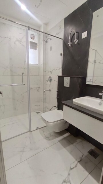 Bathroom in 4 BHK Apartment at Dhakoli Village – for Sale