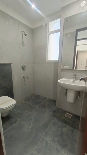 Bathroom in 4 BHK Apartment at Dhakoli Village – for Sale