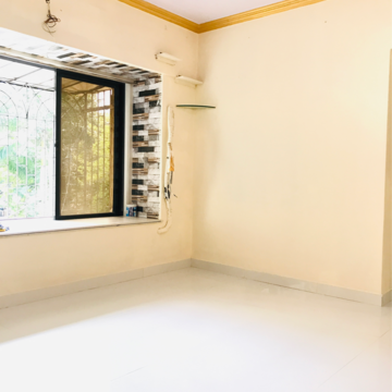 Living Room in 2 BHK Apartment at Veda CHS, Dahisar West – for Sale