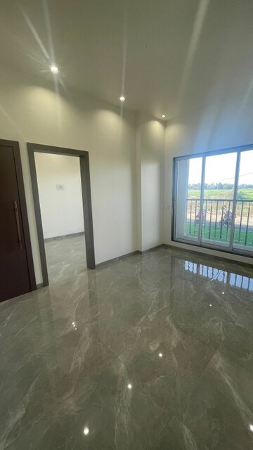 Living Room in 1 BHK Apartment at Rajlaxmi Nakshatra Auris, Nalasopara West – for Sale