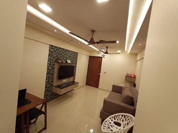 Living Room in 1 BHK Apartment at Lodha Palava Downtown, Dombivli East – for Sale