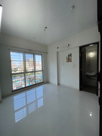 Master Bedroom in 1 BHK Apartment at Sheth Midori, Dahisar East – for Sale