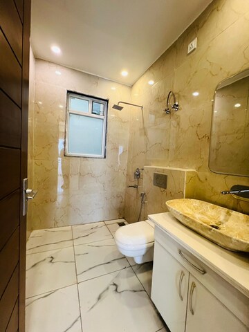 Bathroom in 4 BHK Builder Floor at Ansal Api Versalia 2, Sector 67a – for Sale