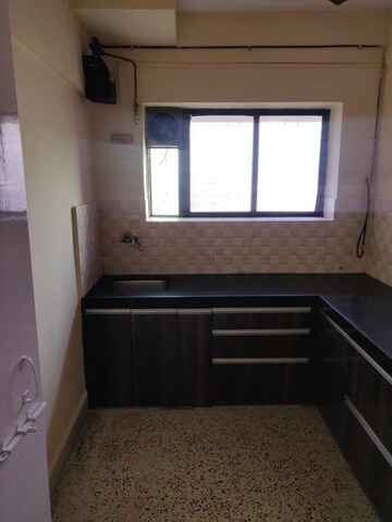 Kitchen in 2 BHK Apartment at Nalanda CHS, Vashi Sector 17 – for Sale