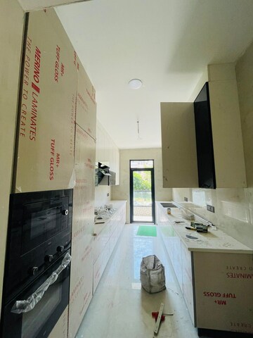 Kitchen in 4 BHK Builder Floor at Ansal API Esencia, Sector 67 – for Sale