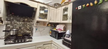 Kitchen in 3 BHK Apartment at Green Valley Heights, Dhakoli Village – for Sale