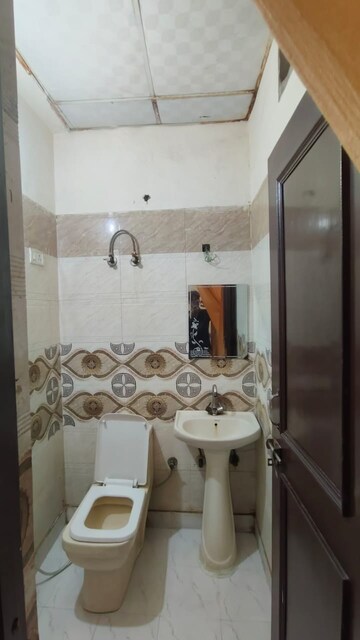 Bathroom in 3 BHK Apartment at Amrapali Golf Homes, Sector 4, Greater Noida – for Sale