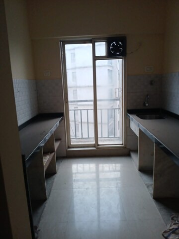 Kitchen in 1 BHK Apartment at Rosa Gardenia, Ghodbunder Road – for Sale