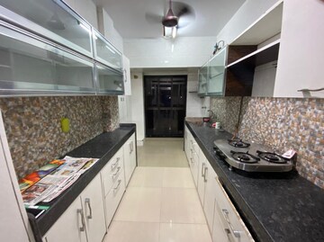 Kitchen in 2 BHK Apartment at Orchid Enclave CHS, Andheri East – for Sale