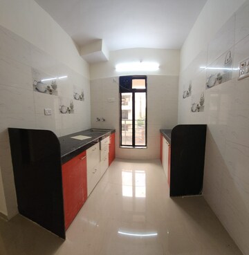 Kitchen in 1 BHK Apartment at Shreenath Parasnath Garden, Umroli – for Sale