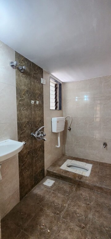 Bathroom in 1 BHK Apartment at Shreenath Parasnath Garden, Umroli – for Sale