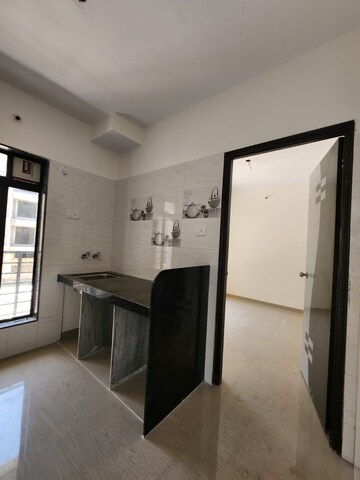 Kitchen in 2 BHK Apartment at Shreenath Parasnath Township, Boisar – for Sale