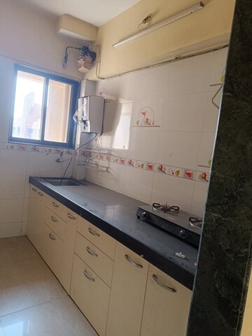 Kitchen in 2 BHK Apartment at Pushpanjali Heights, Owale – for Sale