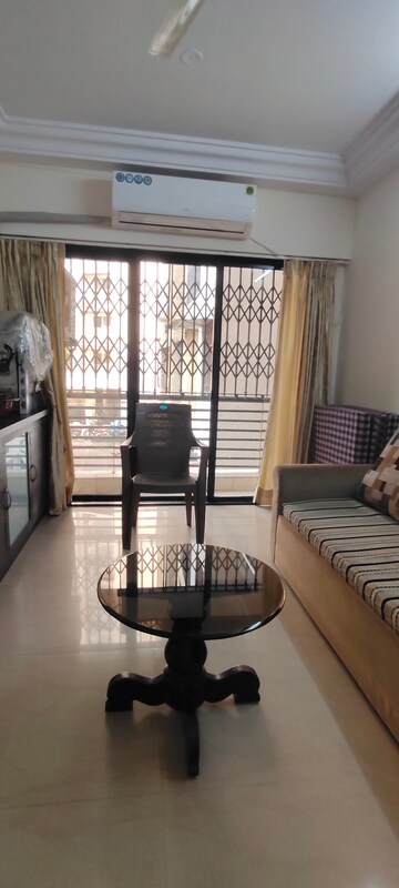 Living Room in 1 BHK Apartment at Romell Empress, Borivali West – for Sale