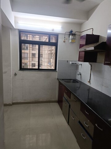 Kitchen in 2 BHK Apartment at Sai Baba Vihar Complex, Ghodbunder Road – for Sale