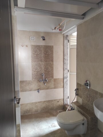Bathroom in 1 BHK Apartment at Gangotri Glacier CHS, Waghbil – for Sale