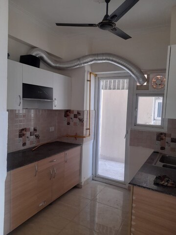 Kitchen in 3 BHK Apartment at Amrapali Golf Homes, Sector 4, Greater Noida – for Sale