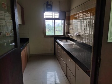 Kitchen in 2.5 BHK Apartment at Vijay Enclave, Waghbil – for Sale
