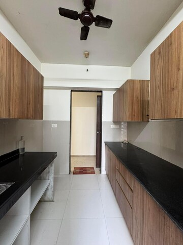 Kitchen in 2.5 BHK Apartment at Lodha Splendora, Ghodbunder Road – for Sale
