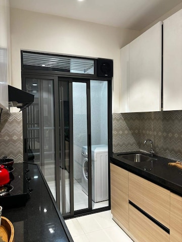 Kitchen in 1 BHK Apartment at Hiranandani The Walk, Ghodbunder Road – for Sale