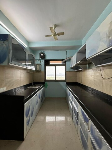 Kitchen in 3 BHK Apartment at Lodha Splendora, Ghodbunder Road – for Sale