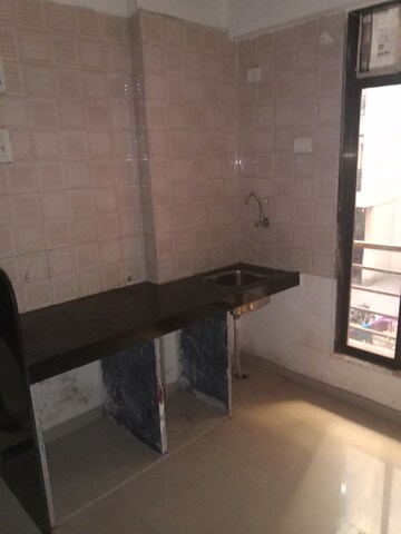 Kitchen in 1 BHK Apartment at Maad Yashwant Pride-Kini Complex, Naigaon East – for Sale