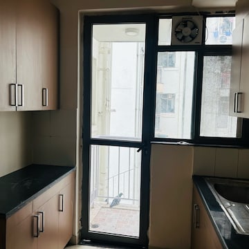 Kitchen in 2 BHK Apartment at Unitech Uniworld Resorts-The Residences, Islampur – for Sale