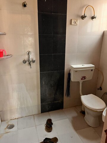 Bathroom in 4 BHK Apartment at Raja Park – for Sale