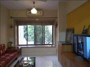 Living Room in 2 BHK Apartment at Nav Sanyukt CHS, Andheri East – for Sale