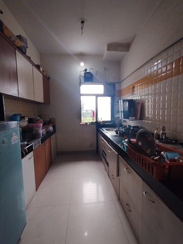 Kitchen in 2.5 BHK Apartment at Vijay Enclave, Waghbil – for Sale