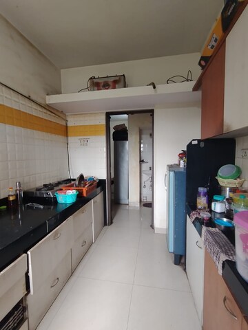 Kitchen in 2.5 BHK Apartment at Vijay Enclave, Waghbil – for Sale